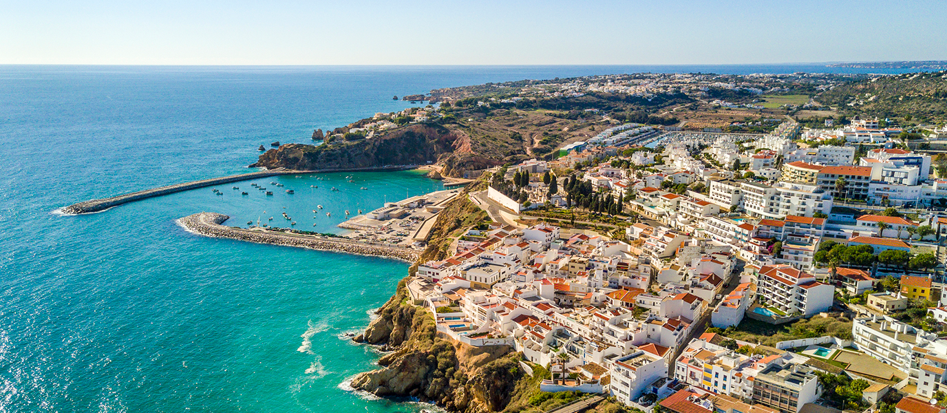What to see in Albufeira: stroll along narrow whitewashed streets with an Arab heritage, and see the Algarve’s golden cliffs